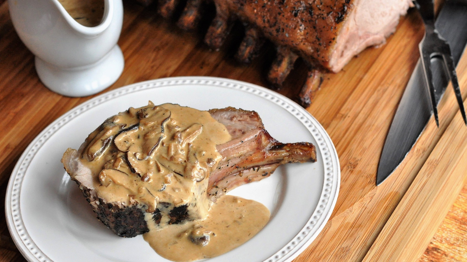 Image of Reverse-Seared Rack of Pork with Creamy Wild Mushroom Brandy Sauce