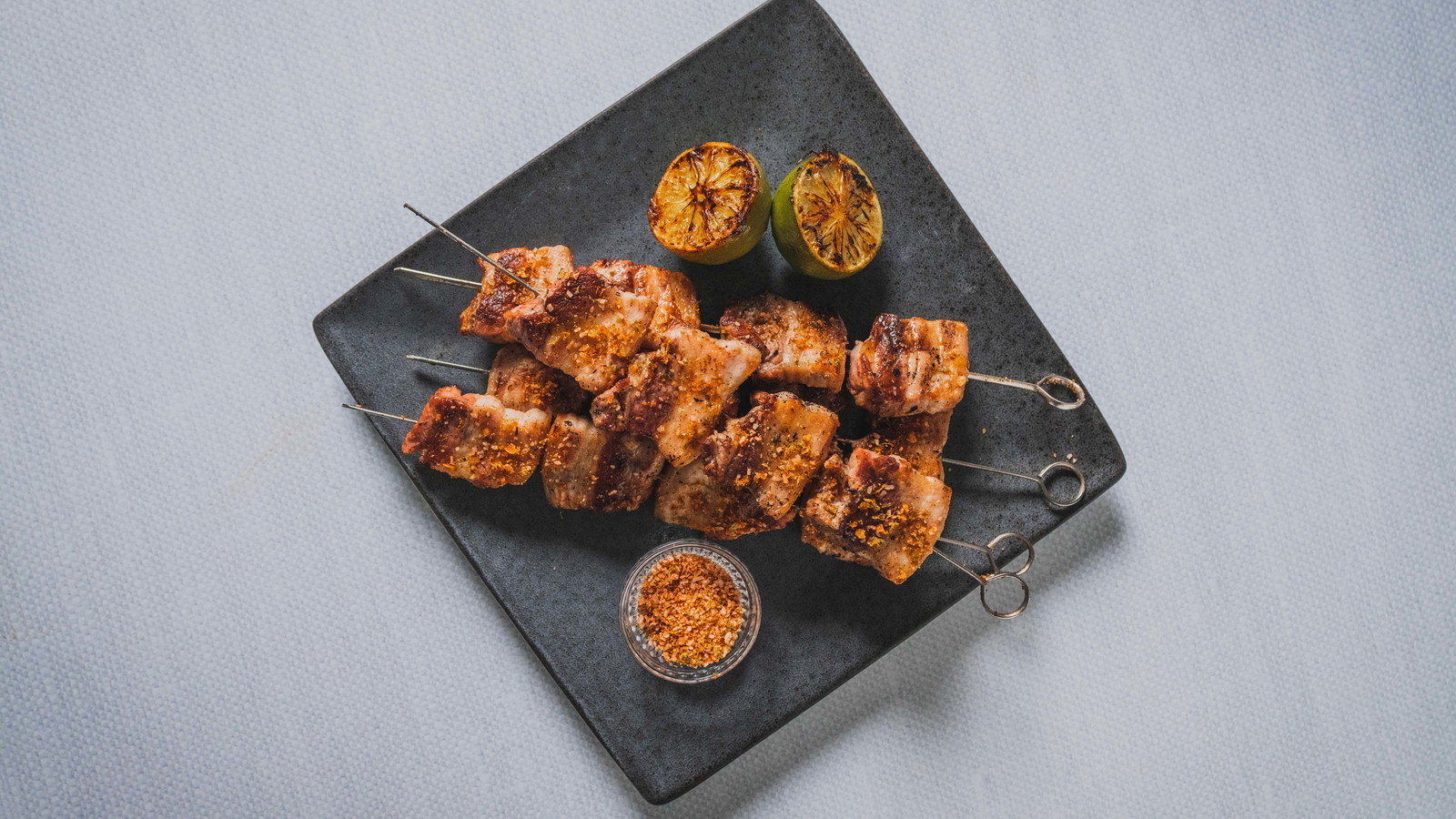 Image of Grilled Pork Belly Skewers with Chili Lime Salt