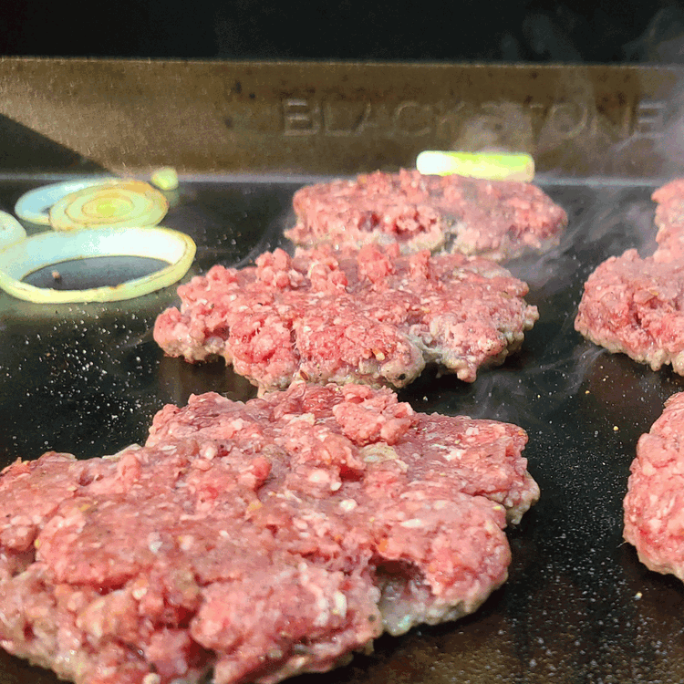 Image of Increase the griddle heat to high. Place the elk meat balls on the hot griddle and smash them down with a heavy spatula to form thin patties. (if you like a thicker juicier patty, just don’t squash so hard) 