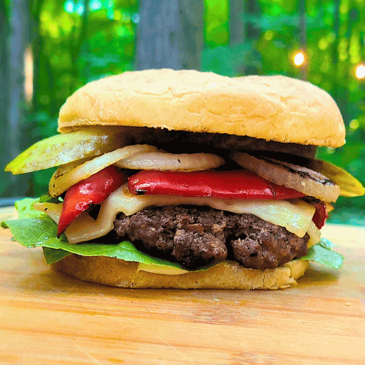 Image of Add your favorite toppings like lettuce, pickles, and any sauces you prefer, then close the burger with the top bun.
