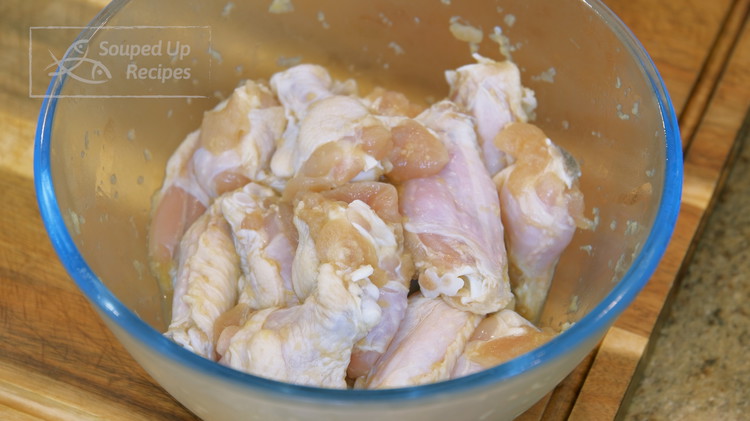 Image of By now, the chicken wings should be done marinading. Take them out of the fridge, and we will coat them.