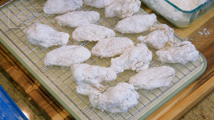 Image of Spread a layer of flour mixture at the bottom of a big container. Place the chicken wings into the container one by one and cover them with another layer of flour. Put on the lid and shake really well. Open...