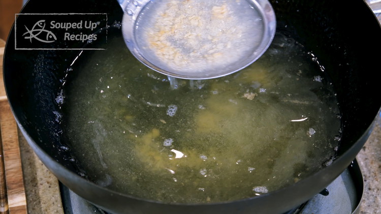 Image of You may need to fry the wings in 2-3 batches, depending on the size of your wok. Use a sieve to eliminate the crumbs from the oil before you fry the next batch. Otherwise, they will burn and bring a...