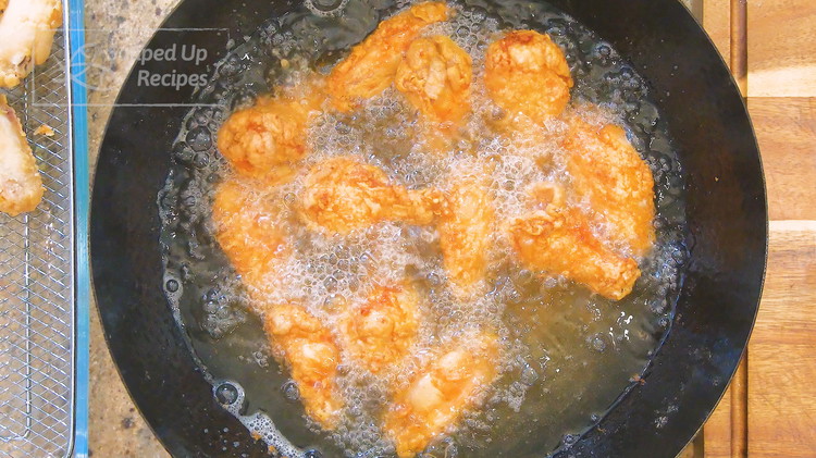 Image of After the wings are rested for 15 minutes, increase the oil’s temperature to 380F and fry the wings for 3 minutes or until golden brown. The first frying is to cook the wings. The second frying is to reinforce the...