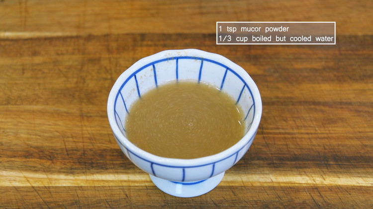 Image of Combine 1 tsp mucor powder with 1/3 cup of boiled but cooled water. Stir until no lumps remain. Mucor powder is a type of fungi that is carefully domesticated for fermenting purpose. You can click here to buy it.