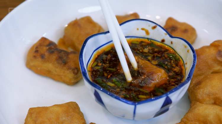 Image of Serve the tofu with the sauce. When you dip the tofu, you have to poke a hole to allow the seasoning to fully infuse into the tofu and then enjoy! It is crispy on the outside and tender on the...