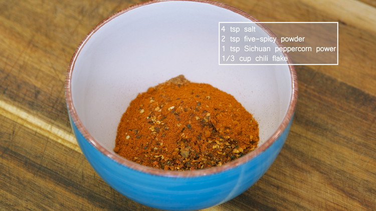 Image of While waiting, add 4 tsp of salt, 2 tsp of five-spice powder, 1 tsp of Sichuan peppercorn powder, and 1/3 cup of chili flake in a bowl. Mix well and set it aside. I used both mild and spicy chili...
