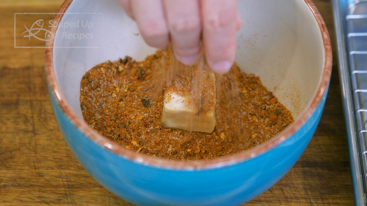 Image of Gently put the tofu into the spice mix and coat evenly. Store the tofu into clean jars. Continue to do the rest. Make sure you keep your wet hand wet and dry hand dry so you don't make a mess....