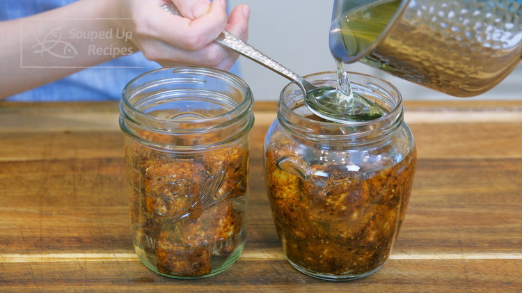 Image of Once done, pour the room-temperature oil into the jar. I use a spoon in between so the oil doesn't hit the tofu direction otherwise the impact force may break the tofu. Make sure the oil is enough to immerse all...