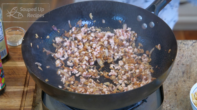 Image of Add the ground pork and stir for a couple of minutes or until the meat changes color.
