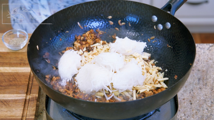 Image of Add the julienned tofu puff and the shredded radish. Stir well and turn off the heat. Tofu puff is very absorbent. That’s why we are adding it after everything else is infused with the seasonings; otherwise, it will soak up all...