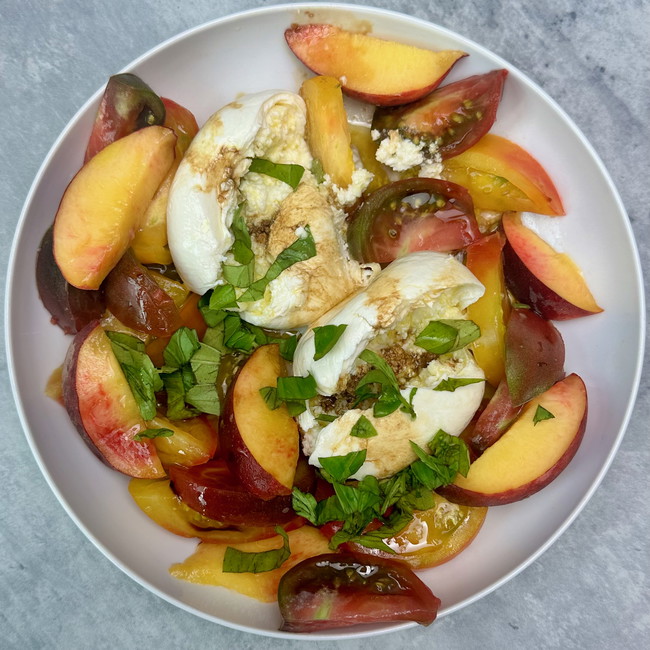 Image of peach, tomato & burrata salad