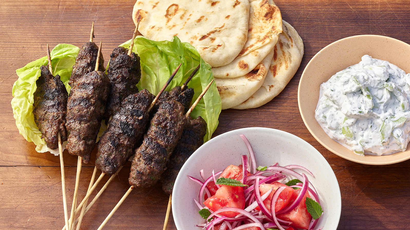 Image of Kofte Kebab with Tzatziki and Israeli Salad