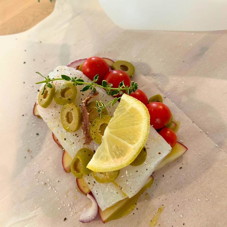 Image of Cut 30cm in length baking paper sheets. Drizzle a little extra virgin olive oil, sea salt on it. Then lay 6 pieces of potatoes, drizzle again with oil and sea salt. Place on top cod, anchovies and once again drizzle...