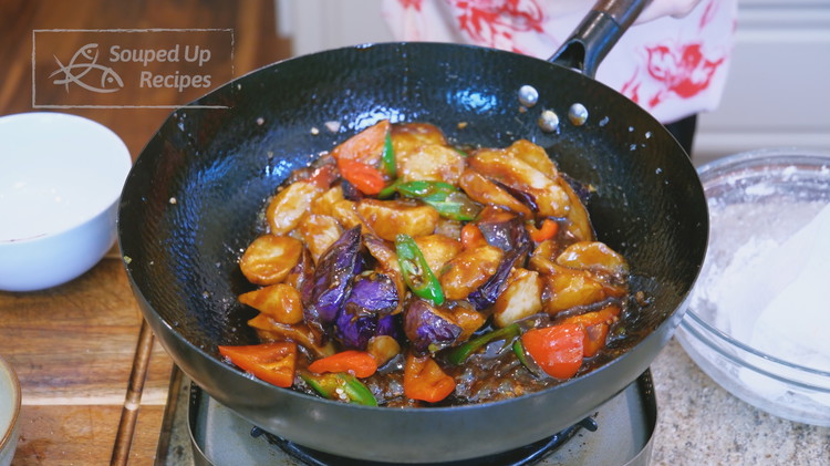 Image of Add the fried potato, eggplant, and pepper to the wok. Drizzle in 2 tsps Chinese black vinegar and mix well. Serve with white rice.