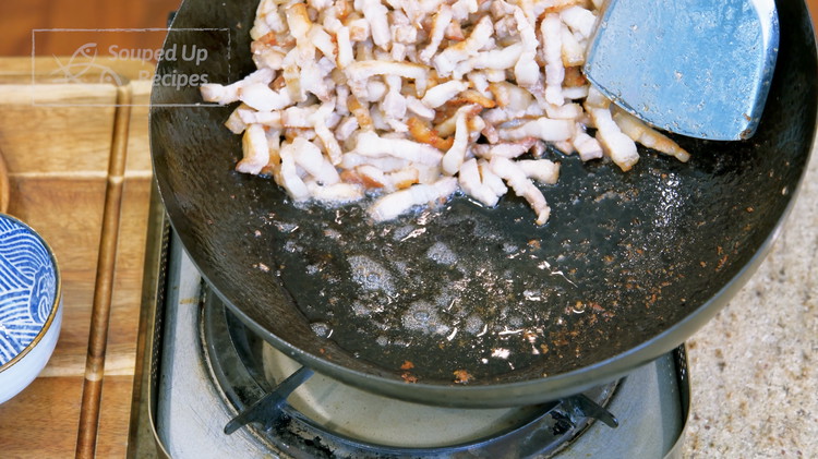 Image of Once you get a generous amount fat in the wok, turn off the heat. Push the pork to the side and let the oil run to one side. Use a spoon to remove some fat so your dish will not come out...
