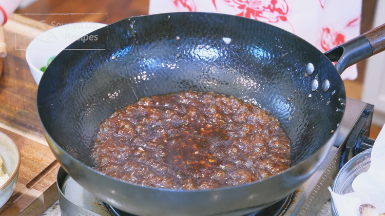 Image of Pour in the seasoning sauce and stir over low heat for 1 minute. Pour in the cornstarch water and continue to stir until thickened.