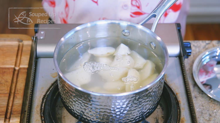 Image of Peel and cut the potatoes into bite-size pieces. Add the potatoes and water to a pot. Turn the heat to medium and cook for 15-18 minutes or until the potatoes are fork-tender. Don’t overcook because the potatoes will be deep-fried...