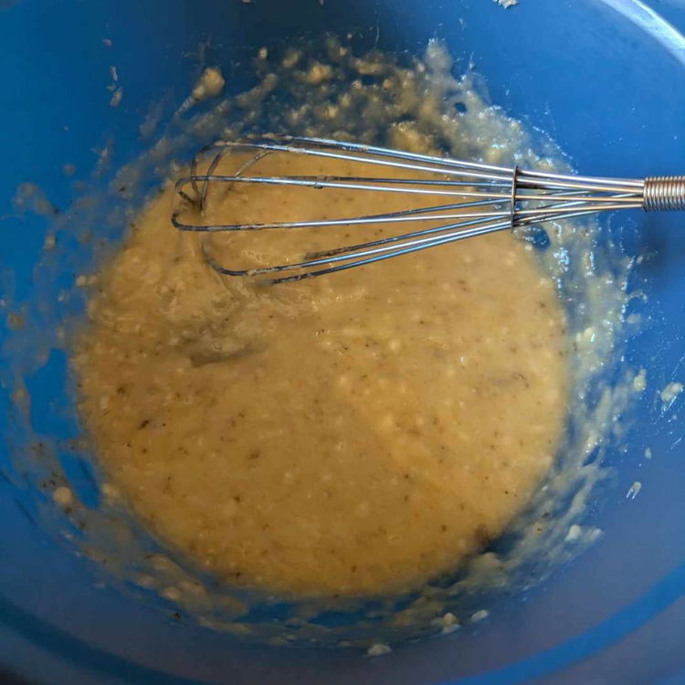 Image of Peel and mash the bananas into a puree. Whisking the...