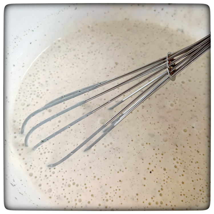 Image of Mix greek yoghurt, mayonnaise, water, vinegar, salt, pepper, parsley, sugar and lemon juice in a bowl and stir well to combine.