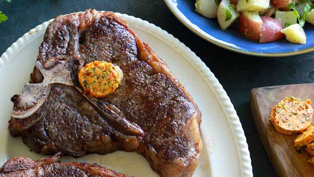 Reverse Seared T-Bones with Harissa-Parsley Butter and Caesar Potato Salad