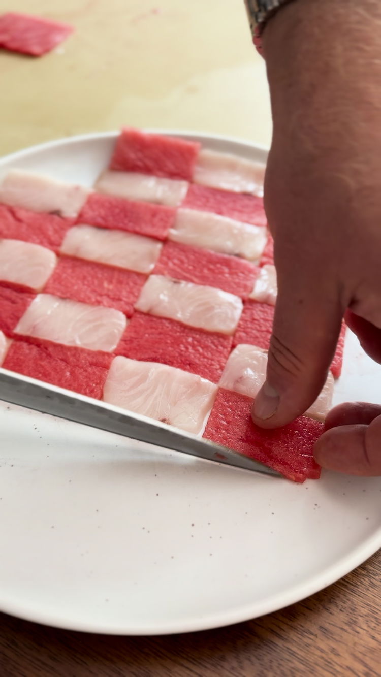 Image of Create a checkered pattern with the yellowtail and watermelon slices.