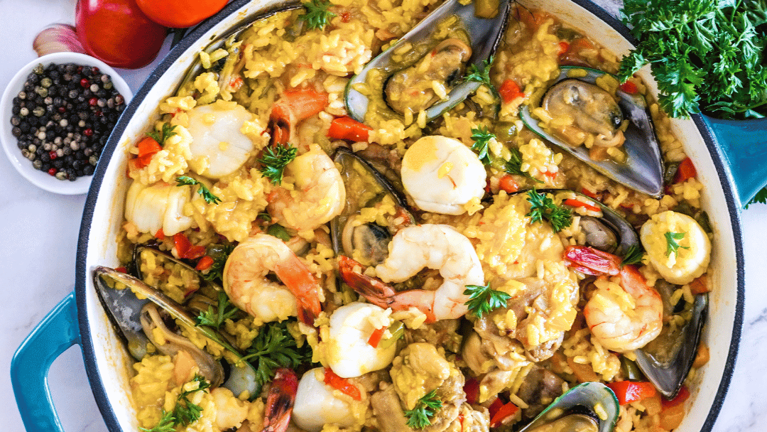 Image of Seafood Paella With Scallops, Mussels, Shrimp & Chicken Thighs In A Rich Saffron Chicken Broth