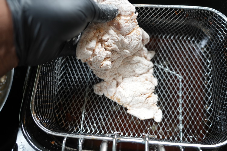 Image of Coat the seasoned chicken into the flour mix, the water , then back to flour. shake off the excess flour and place in the hot grease! 