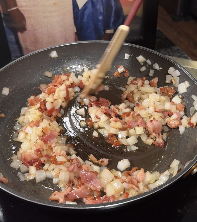 Image of lower heat to med-low and Stir frequently for about 15-20 minutes until the onions start to caramelize. Be patient raising the temp to high can burn it ! 