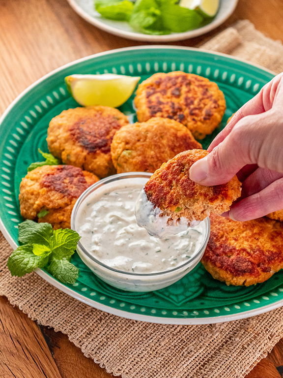 Image of Serve fish cakes hot with yogurt sauce for dipping.