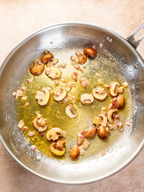 Image of Melt butter over medium heat in a large skillet. Add...