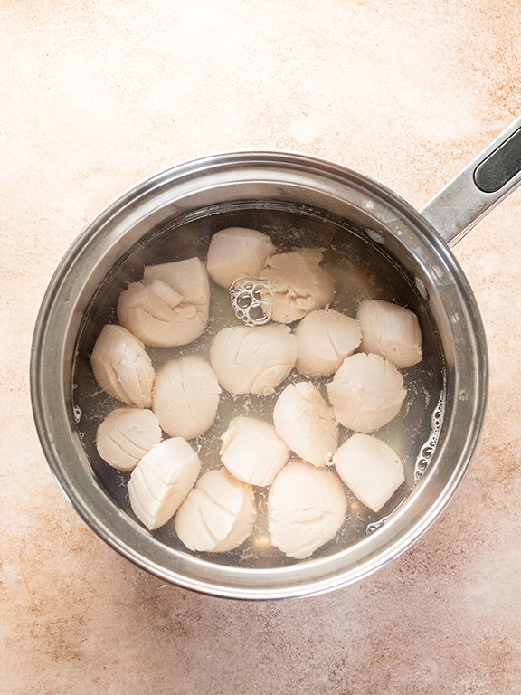 Image of Allow scallops to blanch for 2 minutes. Remove scallops from...