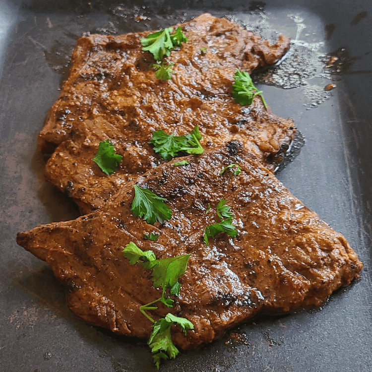 Image of Once cooked to your liking, remove the steak from the grill and let it rest for several minutes under a tent of foil to retain its juices.