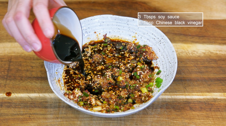 Image of While waiting, make the dipping sauce, or what we call 蘸水. Add 1/2 tsp of salt, 1/3 tsp of Sichuan peppercorn powder, 1/3 tsp of thirteen spice powder, 2 Tbsps of minced garlic, 3 Tbsps diced scallion, 1 tbsp of roasted...