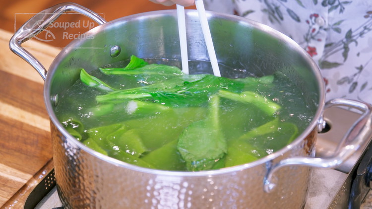 Image of To cook the noodles, bring a pot of water to a boil and add all the noodles. Cook for 1.5 minutes. Optionally, toss in some green leafy vegetables and blanch for 30 seconds. I am using choy sum. You can...