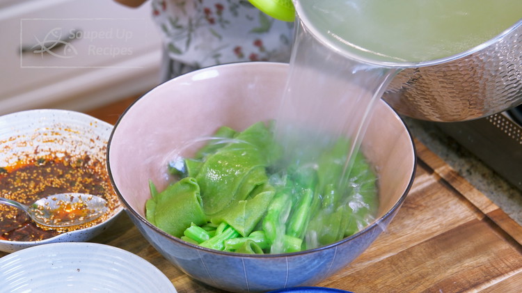 Image of Transfer the noodles and vegetables into a big serving bowl. Pour in some of the noodle cooking water.
