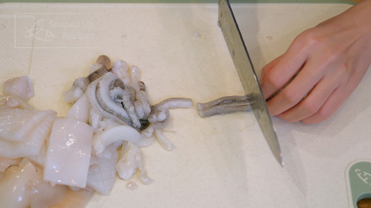 Image of Cut the tentacles into bite-size pieces and rinse everything well. Prepping the squid is a little bit messy. You can ask the seafood market staff to do this for you if possible. You can also buy a bag of frozen...