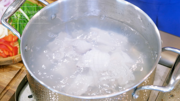 Image of Bring a pot of water to a boil over medium heat. Add the squid and blanch for only 10 seconds. Remove the squid from the pot, and set it aside. Blanching is a popular Chinese method of preparing ingredients before stirring or...