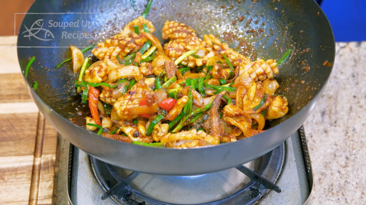 Image of Add the blanched squid. A perfectly stir fry squid must be cooked for less than 2 minutes. Otherwise, the texture will be rubbery. We blanched the squid for 10 seconds before, so now we have to count carefully. Stir the...