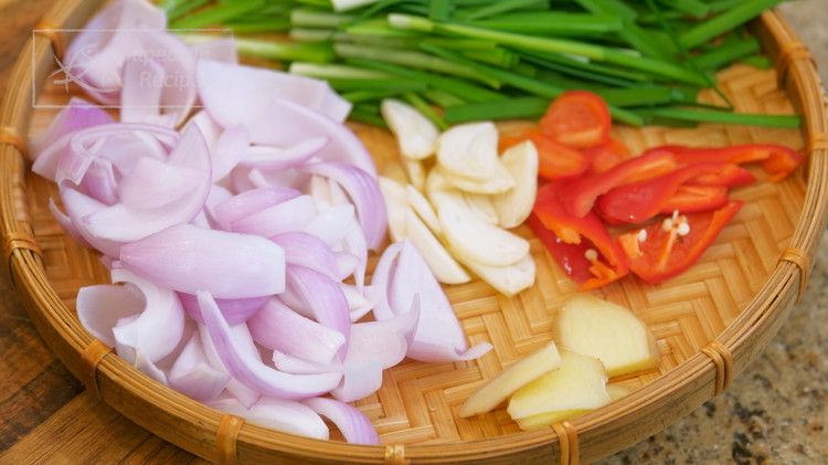 Image of Cut the garlic chives into 2-inch stalks. Chop the red chili into small pieces (optional, for color). Thinly slice 1 inch of ginger and 2 garlic cloves. Peel the shallots and roughly dice them into small pieces. 