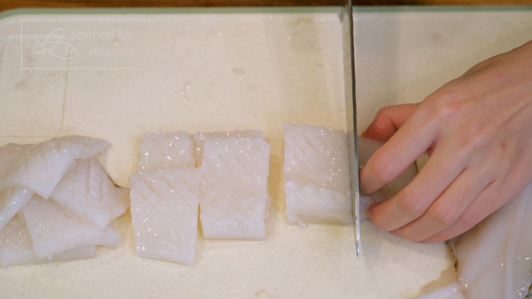 Image of Cut the scored squid into 1.5-inch rectangular pieces. Do the same thing to the fins.