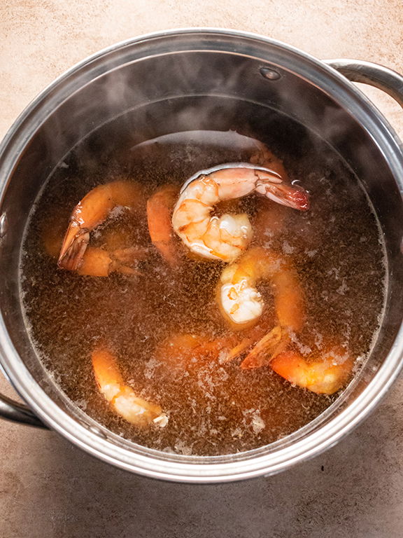 Image of Add shrimp and bring to a simmer. Cook 5 minutes...