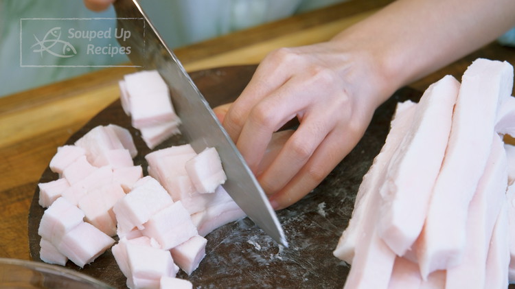 Image of Cut the pork fat into bite-size pieces. If you see a tinny bit of the lean meat still attached. You can either trim it off or leave it. Just remember, the lean meat will impart more porky flavor into the oil.
