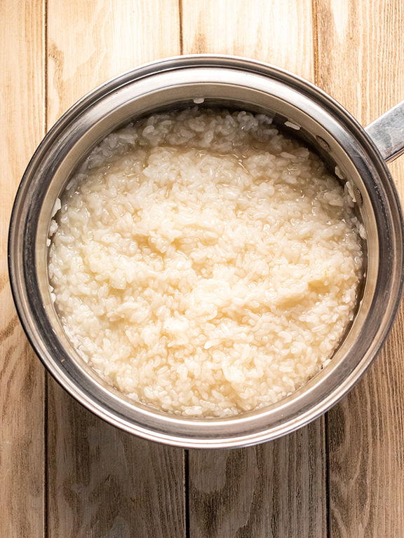 Image of While the rice is cooking, mix the rice vinegar, sugar,...