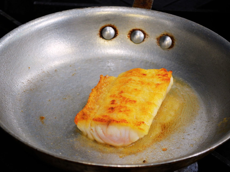 Image of Dust Grey Tilefish in flour and pat off the excess, sautee in hot oil until golden brown. Flip fish and finish in oven at 350°