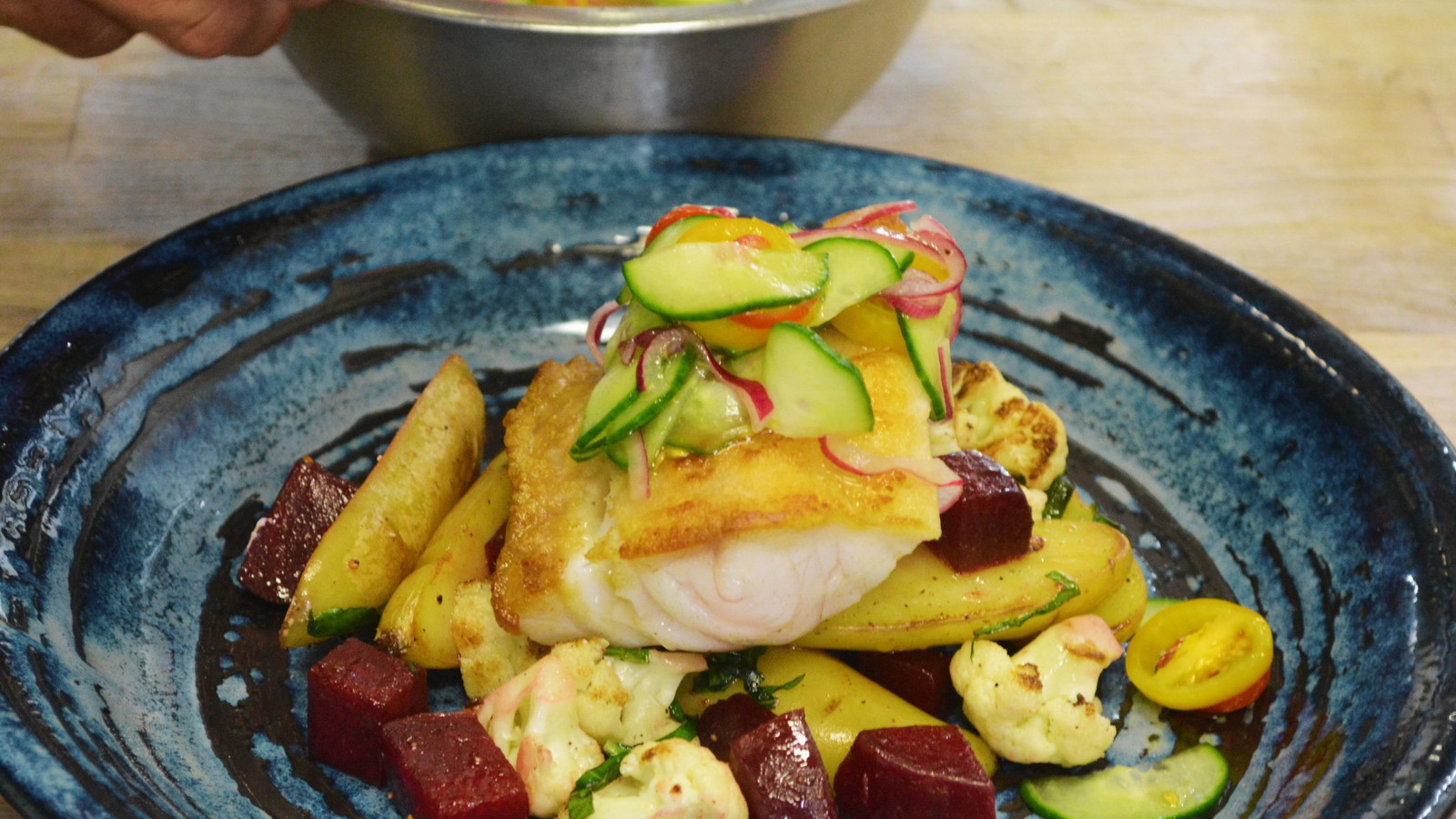 Image of Sauteed Grey Tilefish over Seasonal Vegetables with a Cucumber Salad