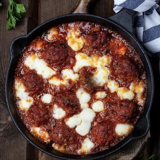 Image of cheesy baked meatballs with burrata