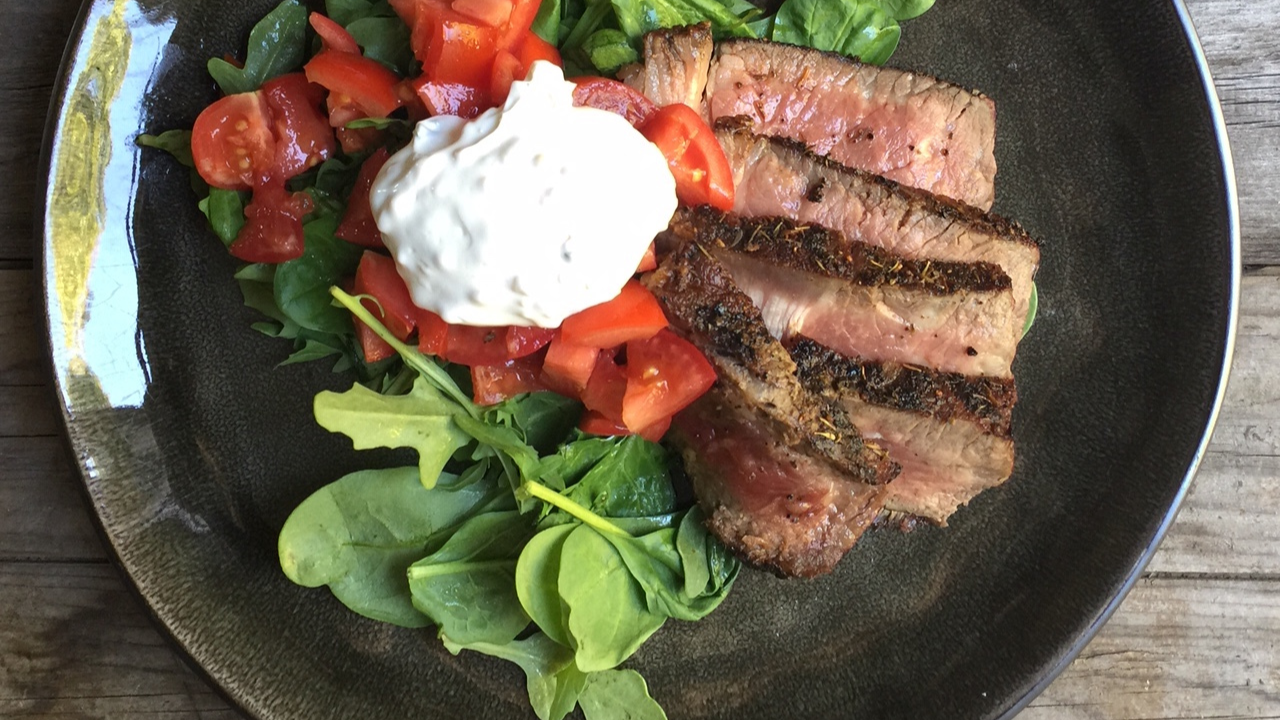 Image of Char Grilled Steak with Tomatoes and Creamy Garlic Sauce