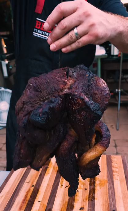 Image of Carefully lower the brisket into the hot oil, ensuring it...