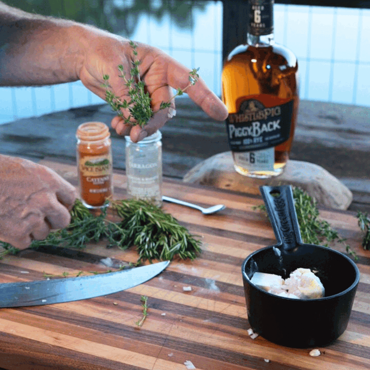 Image of In a small pan, melt the butter over medium heat. Add minced garlic, shallots, thyme, and tarragon to the butter. Saute until fragrant. Stir in the cayenne and whisk in the Rye Whiskey, cooking for another minute until the alcohol...